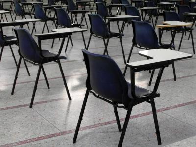 An empty classroom. Dr. Laurel Williams discusses the psychological effects of active shooter drills and metal detectors on schoolchildren.